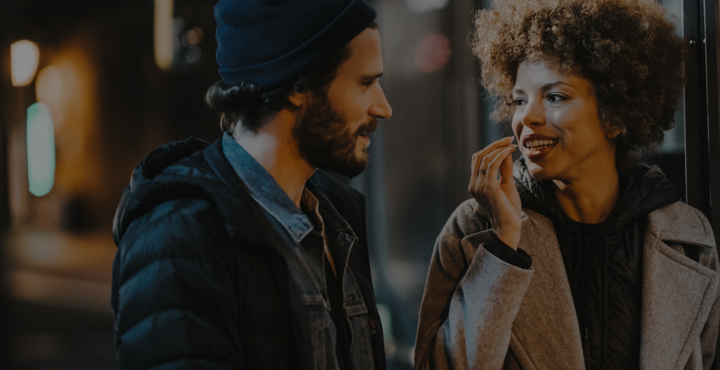 a man and woman looking at each other